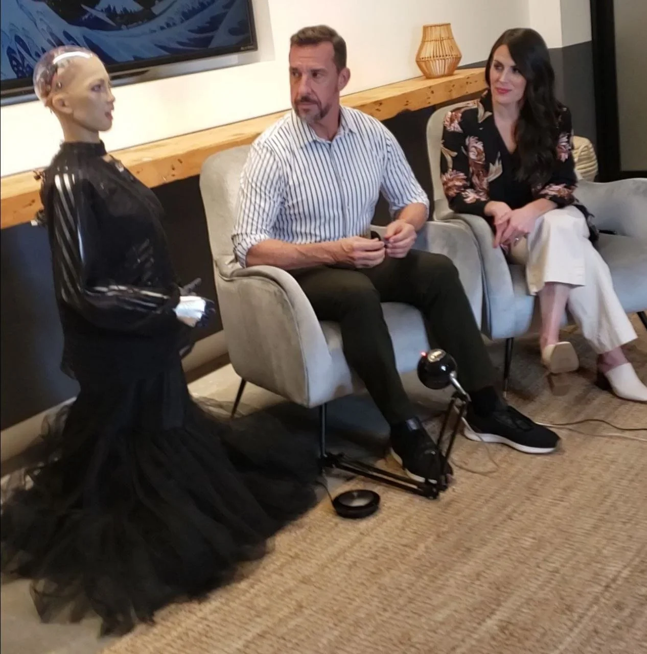 Bill Inman presenting alongside Grace the Healthcare Robot at a robotics and Ai conference